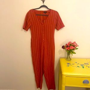 Burnt orange, striped, cotton onesie. Size-small, good quality!